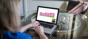 Woman on a computer looking at a feed chart and video consultation.